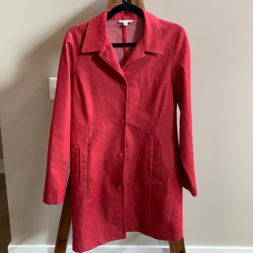 Erik Stewart red trench coat